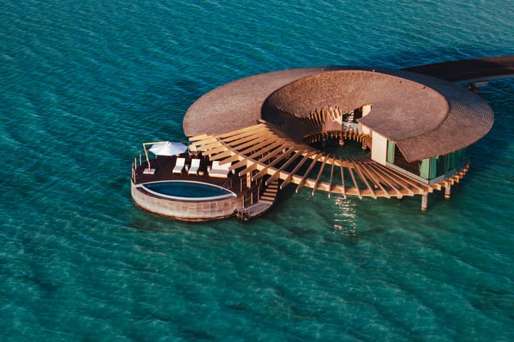 Offshore villas with helical structures, offering stunning sea views