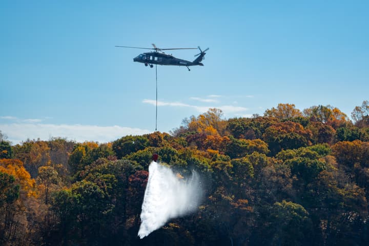 An autonomous Black Hawk helicopter fighting a simulated wildfire