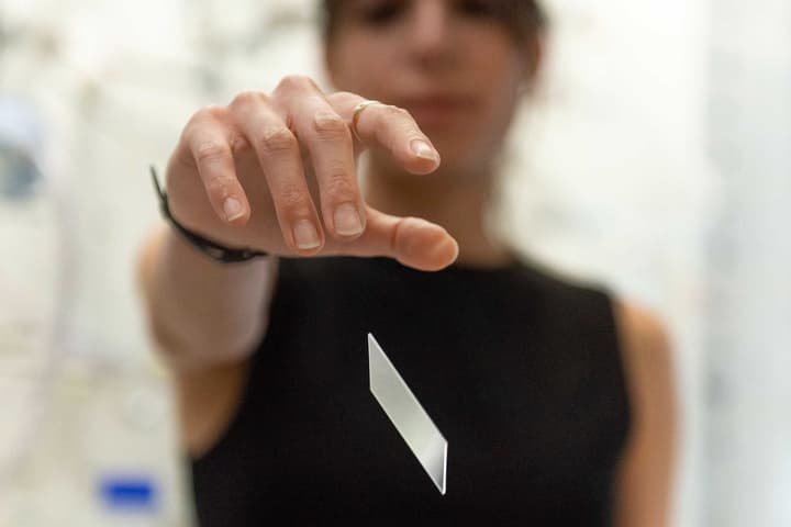 A sample of a glass-based version of the material (which weighs the same as regular glass) gets dropped for testing – a silicon-based version was also developed