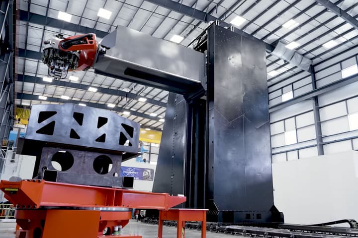 The 39 foot tall carbon composite 3D printer can lay 328 ft of carbon fiber per minute